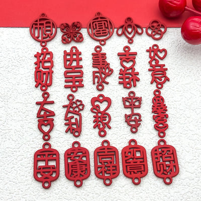 Red assorted shape charms arranged on a light background
