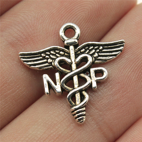 Antique Silver NP caduceus medical symbol charm front view on fingertips