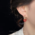 Gold-Tone Oval Huggie Red Open Heart Accent Earrings Pair view 2