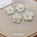 White Flower Pearl Clip On And Stud Earrings With Decorative Details view 2