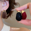Gold Tone Flocked Crescent Stud Earrings in Black and Brown view 2