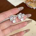 Gold and Silver Sculptural Flower Oval Drop Stud Earrings view 2