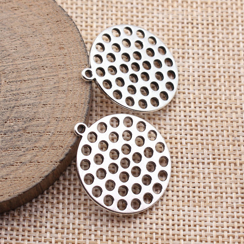 Multi Finish Perforated Round Disc Connector displayed on a natural textured background