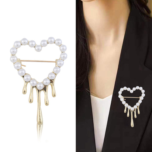 Gold pearl heart brooch product shot and worn on black blazer