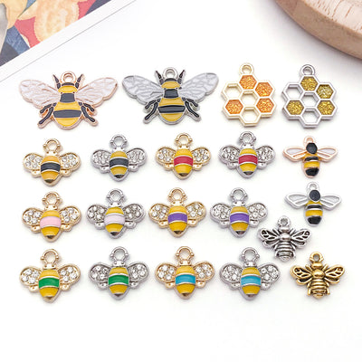 Colorful bee charms arranged on a light background