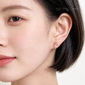 Gold Tone Flower Cluster And Clear Teardrop Stone Stud Earrings view 2