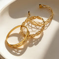 Hollow Link Clasp and Open Twist Bangles Gold Steel view 3