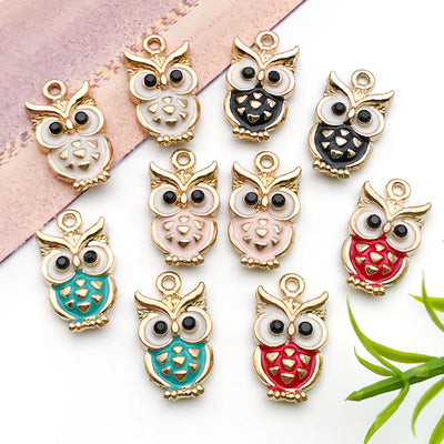 Colorful assorted shape charms arranged on a light background