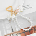 Pearl Bead Wristlet Keychain with Bow and Sakura Flower Charms view 3
