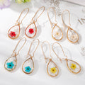 Gold Tone Large Clear Resin Pressed Flower Teardrop Earrings view 1