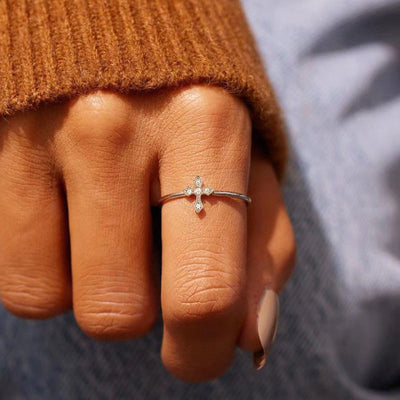 Product view showing tiny clear-stone cross ring