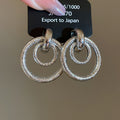Textured Interlocking Circle and Knot Stud Earrings view 10