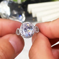 Oval White Stone Ring with Round Side Stones and Pavé Band view 2