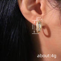 Gold Tone Baguette Crystal Pave Huggie Earrings view 4