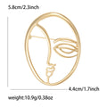 Abstract Single Line Face Brooch in an Oval Metal Frame view 6
