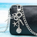 Three Silver Tone Bow Shell and Starfish Clasp Keychains view 4