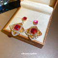 Gold Tone Red Crystal and Rose Flower Drop Stud Earrings view 2
