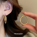 Polished Metal Teardrop Hoop Earrings in Six Size and Color Options view 4