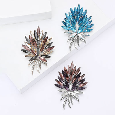Front view of radiating spray of pointed marquise stones above crystal-set stems