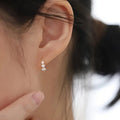 Three Clear Stone Curved Stud Earrings Silver and Gold Tones view 3