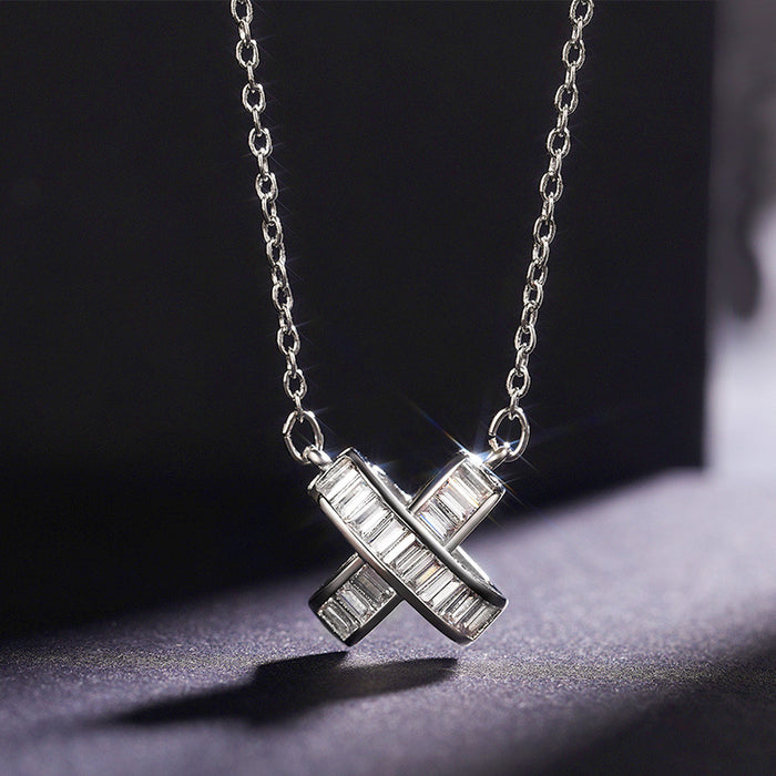 Silver Tone Crossed Bar Pendant Necklace With Clear Stones