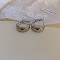 Rounded Hoop And Chain Tassel Earrings In Three Finishes view 8