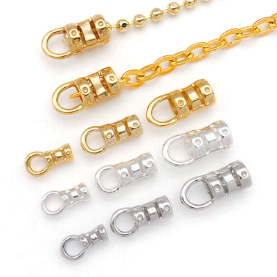 Metal chain end connectors in three sizes arranged as a full product overview