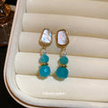 Blue Beaded Geometric Drop Earrings with Polished Metal Details view 2