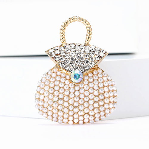 Angled display of the brooch showing its raised decorative details