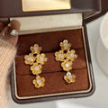 Gold Tone Crystal Flower Cluster Drop Earrings with Metal Tone Details view 6