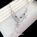 Silver Tone Cross Pendant Necklace with Layered White Beads view 2