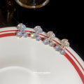 Silver Crystal Bow Stud Earrings in Two Pictured Bow Shapes view 2