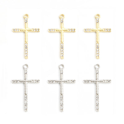 Front assortment of long slim crosses with a line of clear crystals