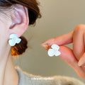 Sculpted Flower Stud Earrings in Gold Tone and White view 4