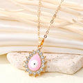 Gold Tone Crystal Halo Teardrop Evil Eye Pendant Necklaces in Four Colors view 7