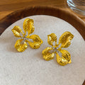 Open Hammered Flower Stud Earrings in Gold and Silver Tone view 6
