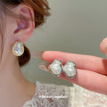 Organic Baroque Pearl Stud Earrings in Three Settings view 3