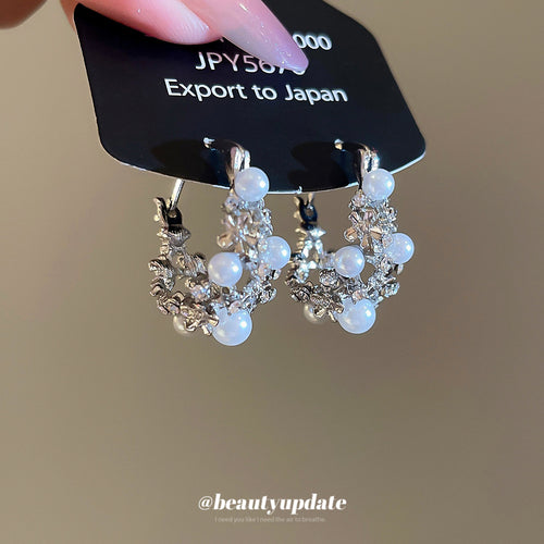 Main image showing silver floral pearl hoops