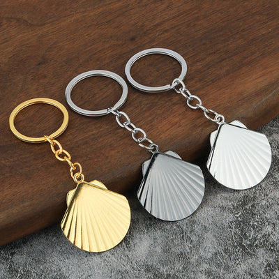 Three layered scallop shell keychains in metallic finishes