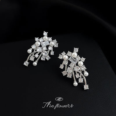 Silver-tone clear-stone floral-tassel earrings in the first product display.