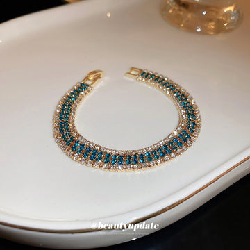 Gold Tone Three Row Bracelet With Teal And Clear Crystals