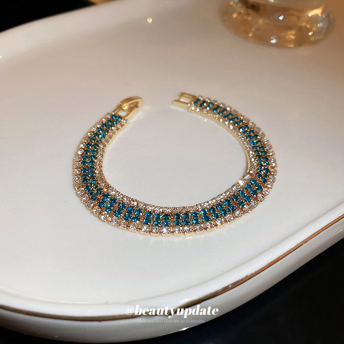 Gold Tone Three Row Bracelet With Teal And Clear Crystals
