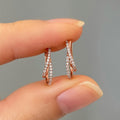 Rose Gold Crossed X Pave CZ Huggie Hoop Earrings Metal view 1