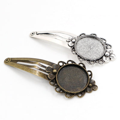 Floral Round Hair Clip Bezel Settings in Two Finishes assortment on a plain background