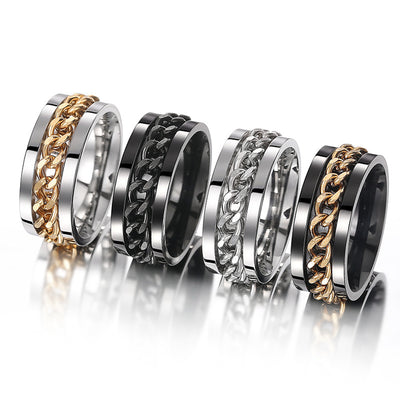 Four spinner chain band rings in steel-gold black steel and black-gold lineup