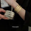 Wide Wavy Metal Cuff In Gold Or Silver Tone With Mixed Gallery Designs view 2