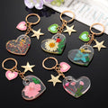 Clear Resin Pressed Flower Heart Clip Keychains in Five Designs view 1