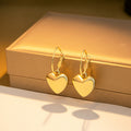 Gold and Silver Polished Heart Small Huggie Earrings view 3