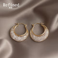 Gold Tone Wide Crescent Textured Hoop Earrings For Women view 1