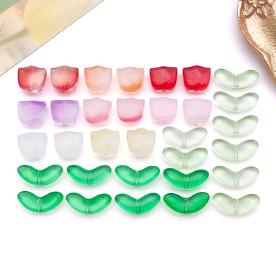 Translucent glass tulip flower and leaf beads arranged as a full product overview